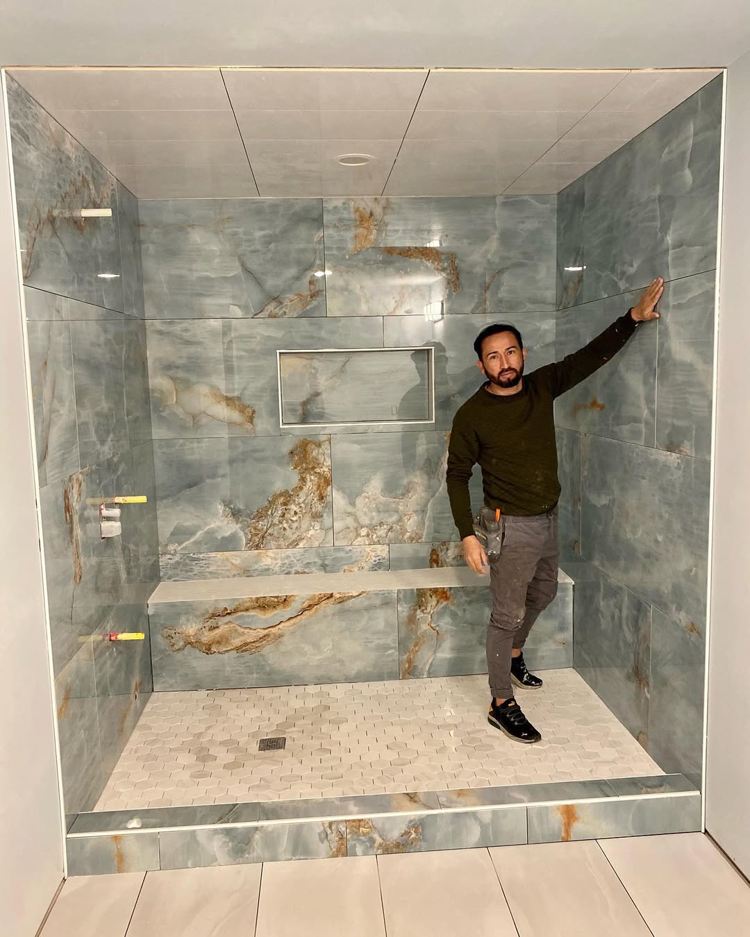 Luxury onyx-marble shower remodel by Joe Moran Packer of Tech Flooring